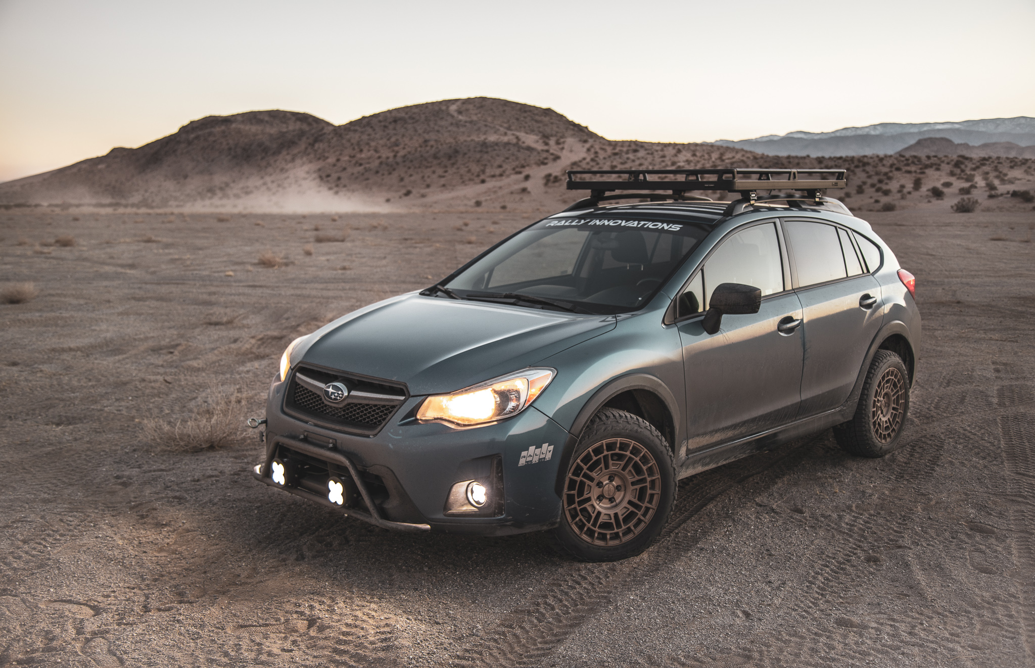 Subaru forester with wild peak all terrain tyres on sand