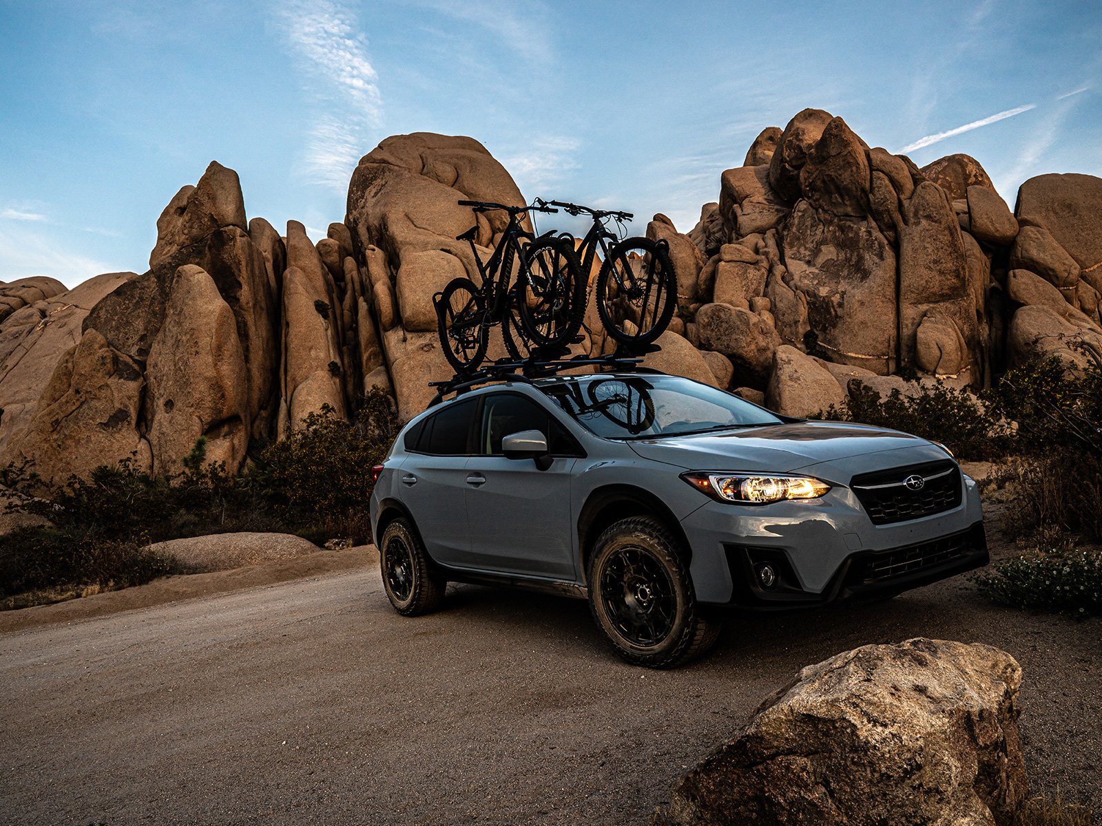 Falken Wildpeak tyres all terrain trails on a Subaru outback carrying mountain bikes on a gravel road