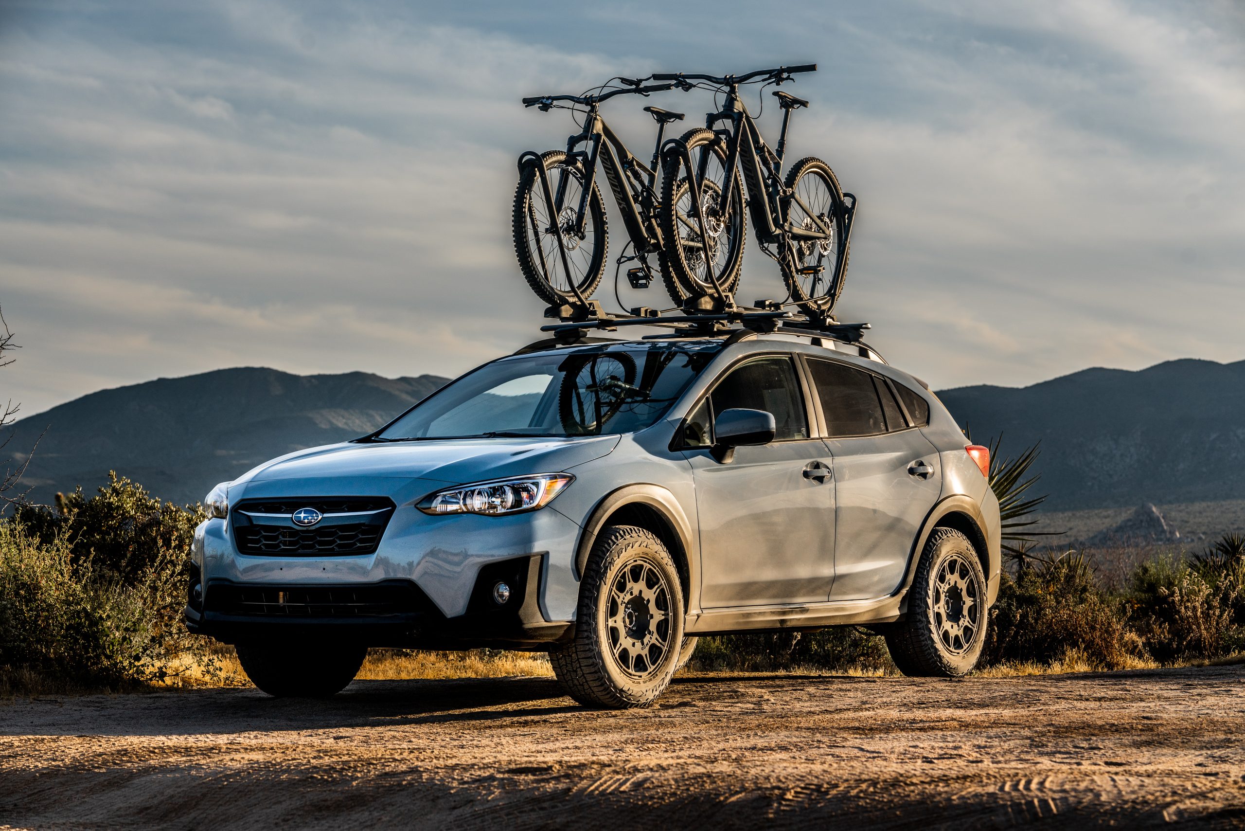 Falken Wildpeak tyres all terrain trails on a Subaru outback carrying mountain bikes on a dirt road